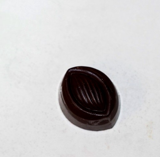 Dark chocolate cocoa pod shaped filled praline